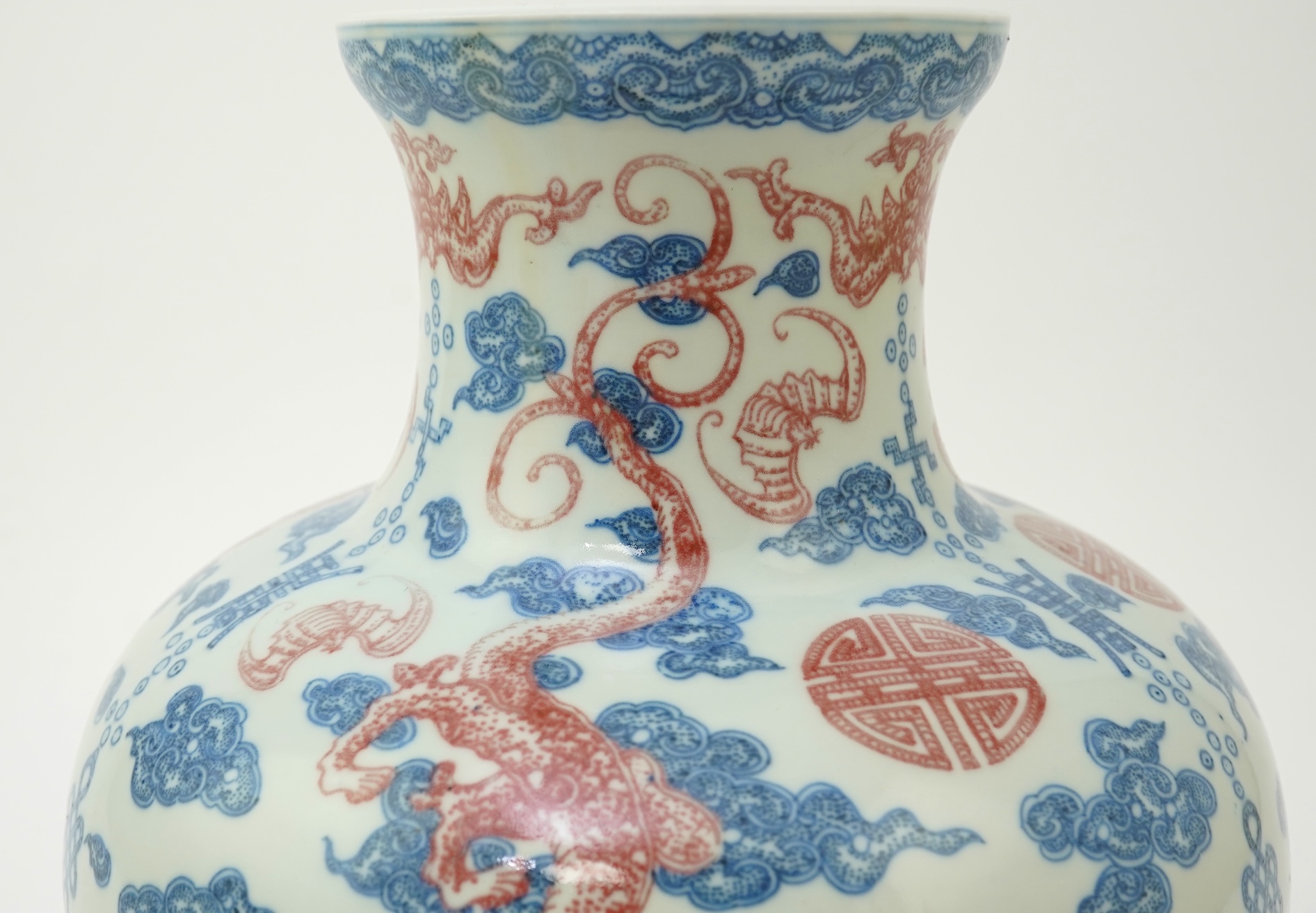 A Chinese underglaze blue and copper red ‘dragon’ vase, Qianlong seal mark but early 20th century